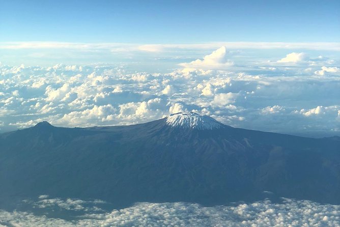 Best Kilimanjaro hiking day trip tour with Kilinge Adventures - Weather reality: clouds and rain change the tone