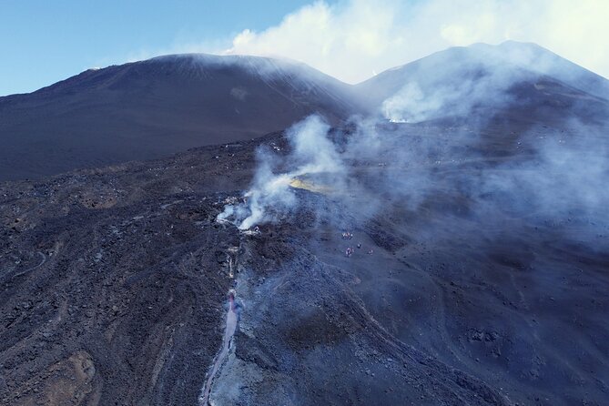 Etna: Cable Car & Hiking Tour to Summit - Descent Toward the 2002 Craters: Volcanic Sand and Controlled Steps