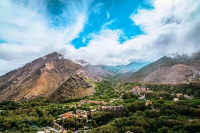 From Marrakech: Atlas Mountains Full-Day Hiking Trip w Lunch - Getting Out of Marrakech: Pickup, Van Ride, and a Camel Break