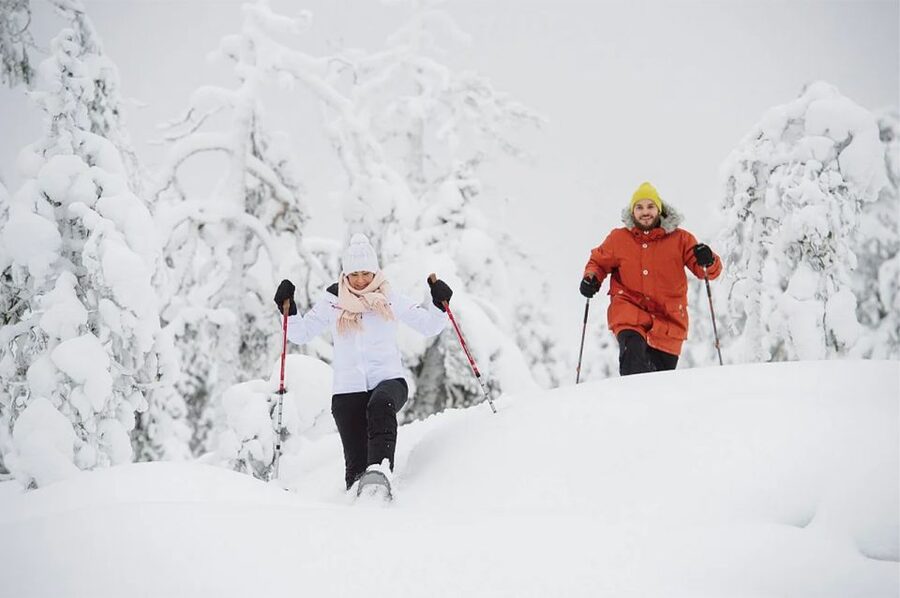 Lapland: Ice Fishing, Floating & BBQ Snow Adventure - Ice floating in survival suits: the relaxed center of the tour