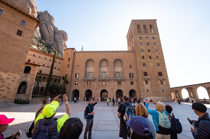 Montserrat Half Day with Cable Car and Easy Hike from Barcelona - Abadia de Montserrat: basilica, atrium, and why the guide matters