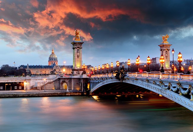 Paris Lights Evening Bus Tour with Eiffel Tower Summit Option - Route highlights: Vendôme, Opéra, Rue de Rivoli, and the Louvre stretch